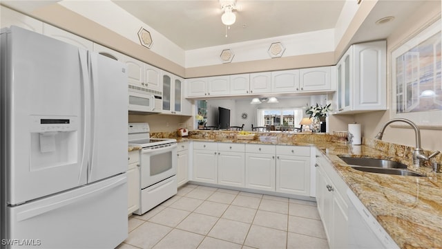 kitchen featuring white cabinetry, white appliances, sink, and light tile patterned floors