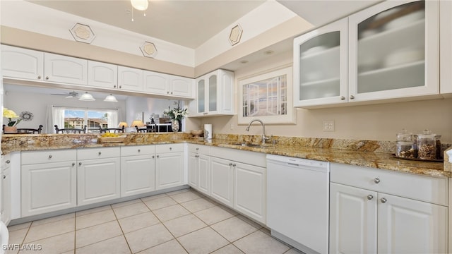 kitchen with white cabinets, sink, and dishwasher