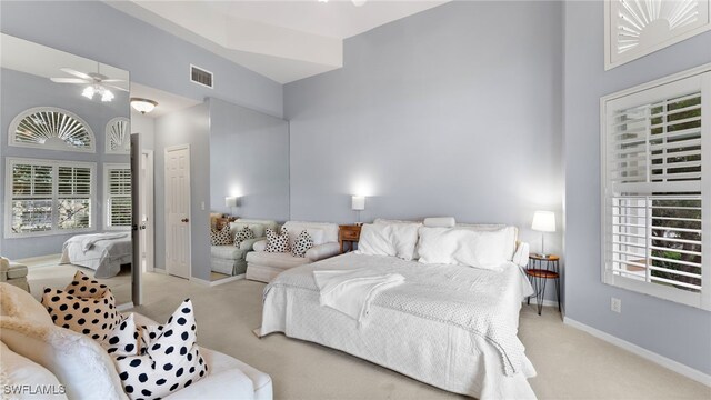 bedroom with light colored carpet and ceiling fan