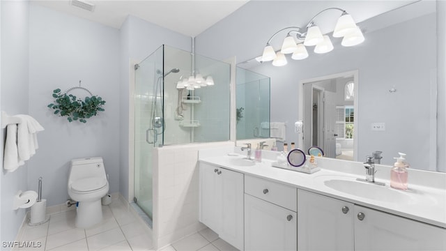 bathroom featuring walk in shower, vanity, toilet, and tile patterned flooring