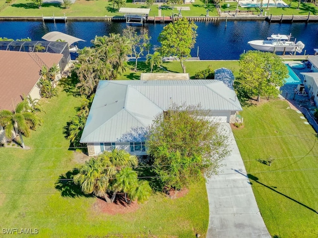 birds eye view of property with a water view