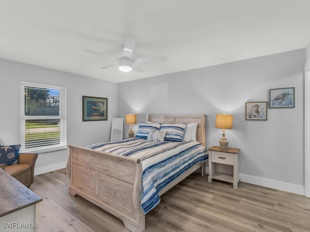 bedroom featuring light hardwood / wood-style flooring and ceiling fan