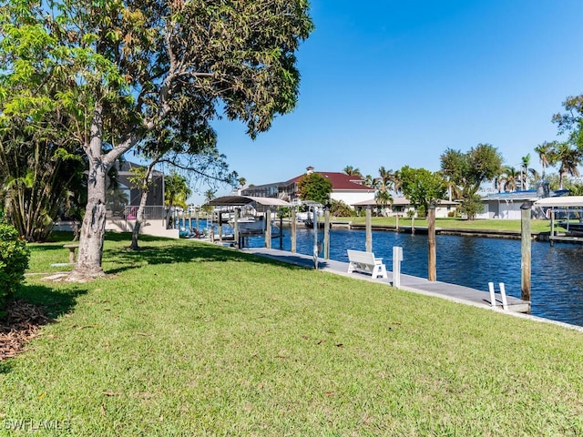 exterior space featuring a yard and a water view