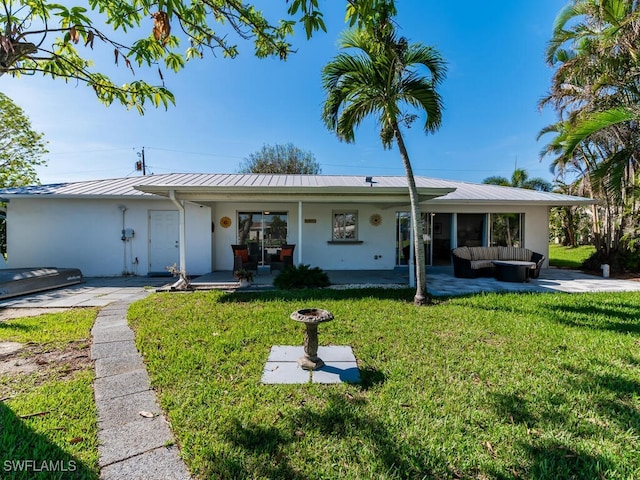 single story home with outdoor lounge area and a front yard