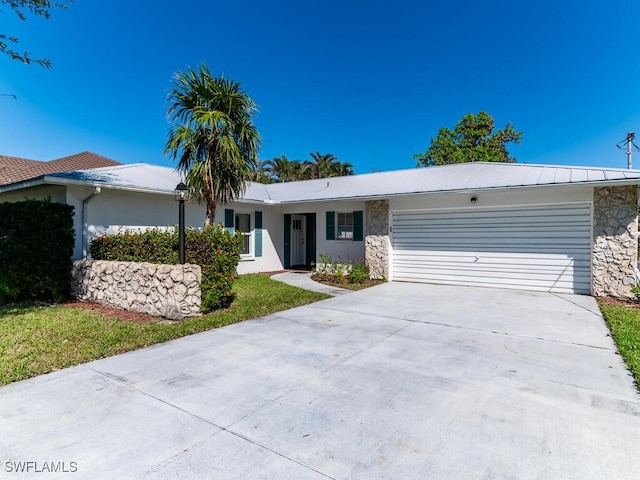 ranch-style house featuring a garage