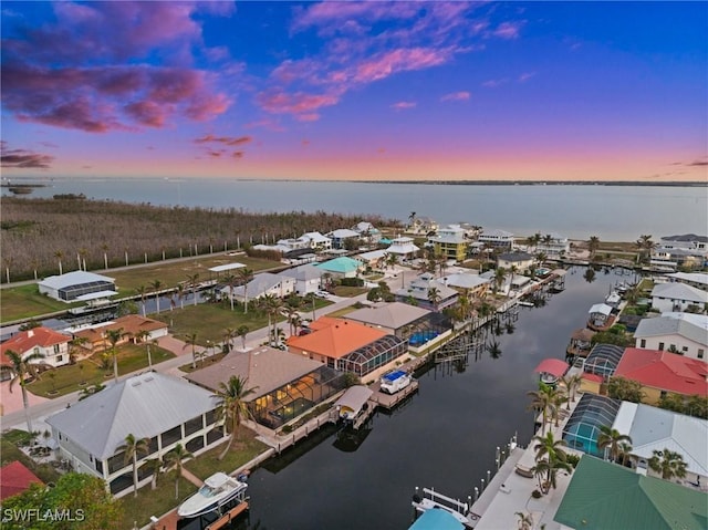 2405 Cherimoya Ln, Saint James City, FL 33956 - aerial view at dusk of a water view and a residential view