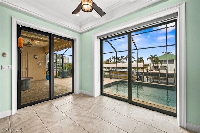 doorway featuring light tile patterned floors, ceiling fan, and ornamental molding