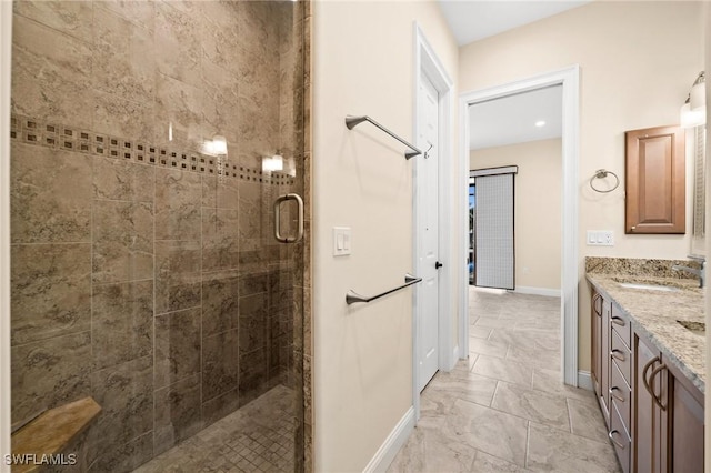 bathroom with vanity and a shower with shower door