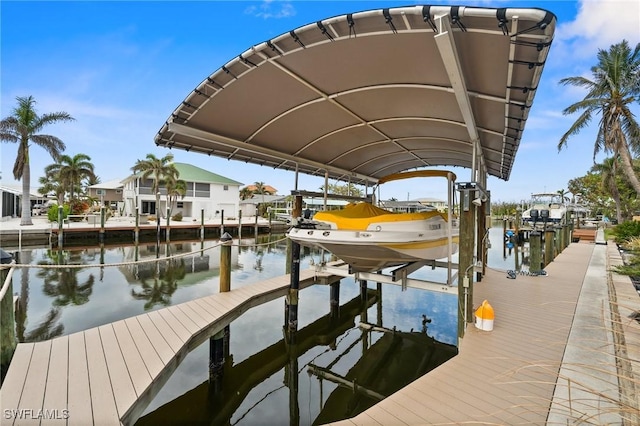 2405 Cherimoya Ln, Saint James City, FL 33956 - dock featuring boat lift and a water view