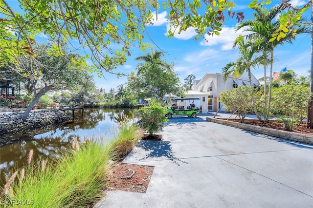 view of patio with a water view