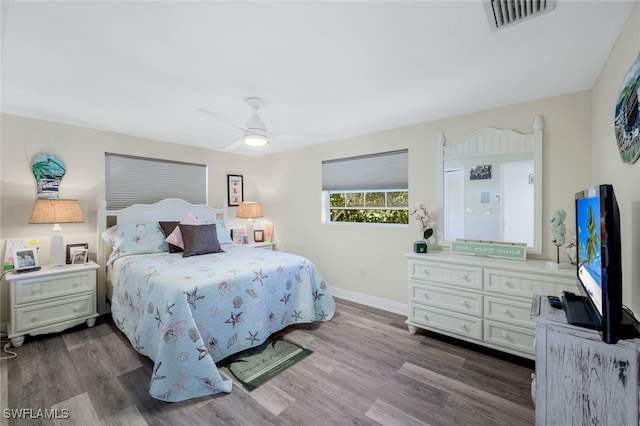 bedroom with wood-type flooring and ceiling fan