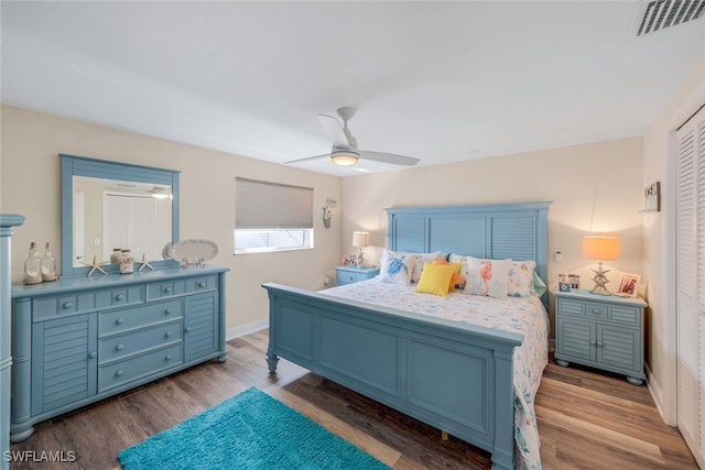 bedroom featuring ceiling fan and wood-type flooring