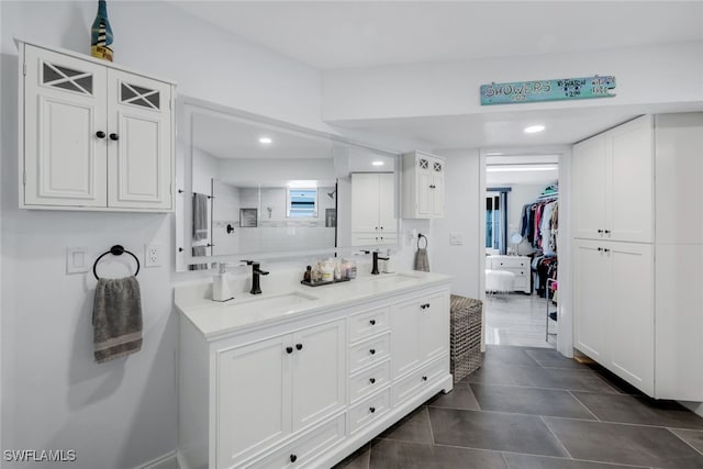 bathroom with tile patterned floors and vanity