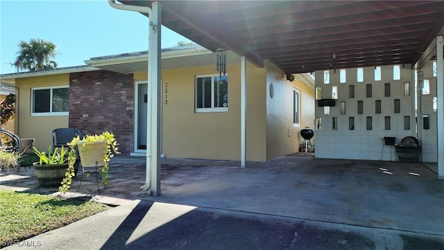 view of patio / terrace with a carport