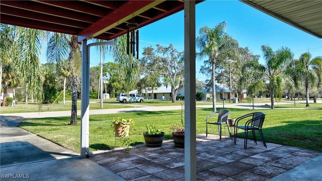 exterior space featuring a lawn and a patio area