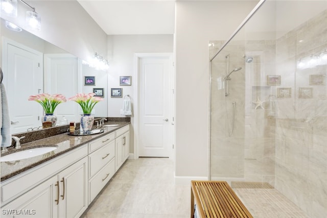 bathroom with vanity and a shower with shower door