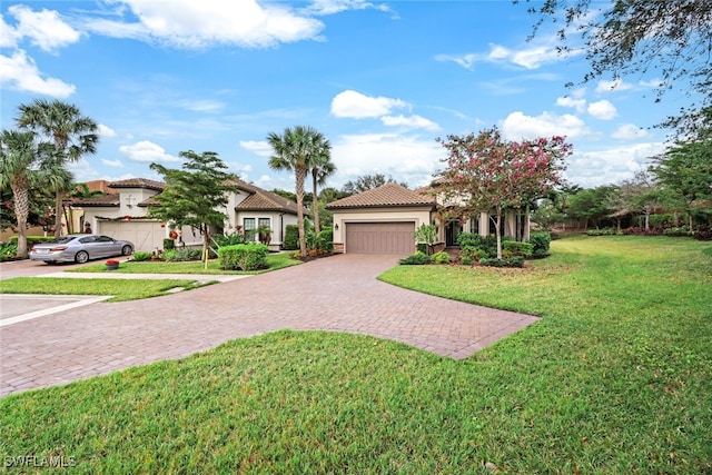 mediterranean / spanish home with a front lawn