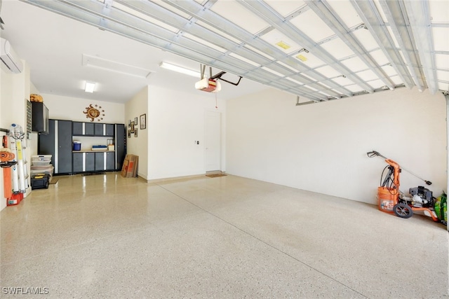 garage with a wall mounted air conditioner and a garage door opener