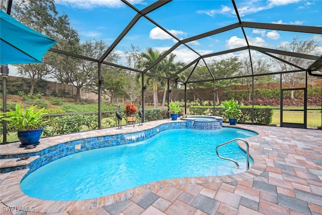 view of pool with glass enclosure, an in ground hot tub, and a patio