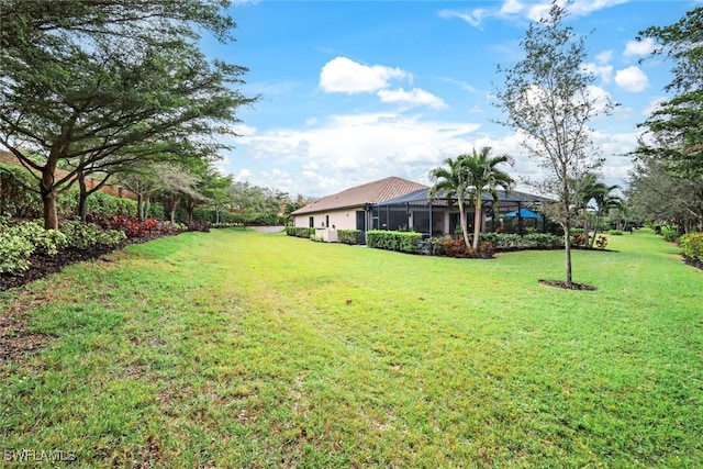 view of yard featuring a lanai