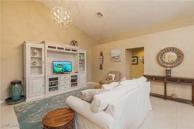 living room featuring an inviting chandelier, lofted ceiling, and light tile patterned flooring