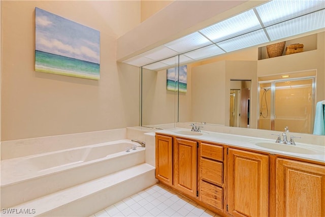 bathroom featuring tile patterned floors, vanity, and independent shower and bath