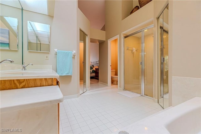 27062 Kindlewood Ln, Bonita Springs, FL 34134 - full bath with tile patterned flooring, a shower stall, vanity, and a skylight