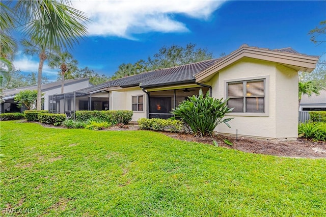 27062 Kindlewood Ln, Bonita Springs, FL 34134 - view of front of house featuring stucco siding and a front lawn