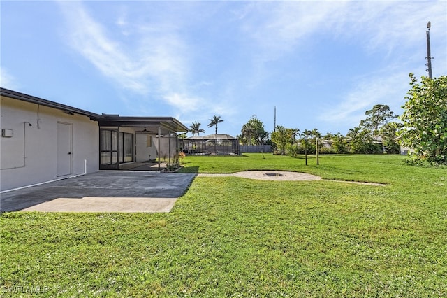 view of yard featuring a fire pit and a patio