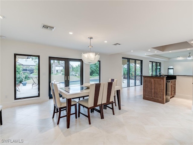 dining room with recessed lighting, visible vents, and french doors