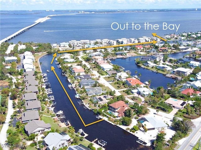 aerial view featuring a water view and a residential view