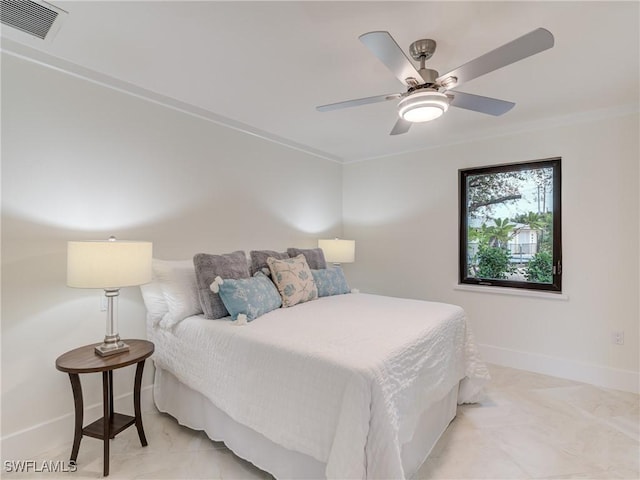 bedroom with a ceiling fan, visible vents, and baseboards