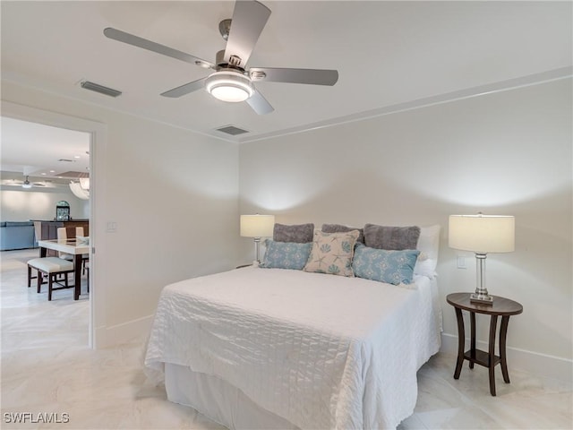 bedroom with a ceiling fan, visible vents, and baseboards