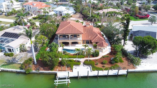 drone / aerial view featuring a water view and a residential view