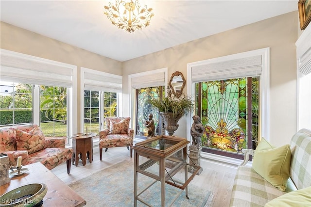 sunroom with an inviting chandelier