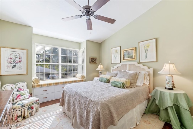 bedroom with ceiling fan and vaulted ceiling