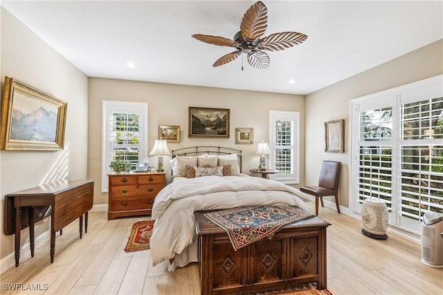 bedroom featuring ceiling fan and light hardwood / wood-style floors