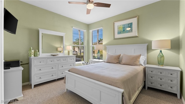 bedroom featuring ceiling fan and light colored carpet