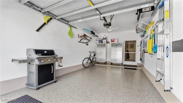 garage with ceiling fan and a garage door opener