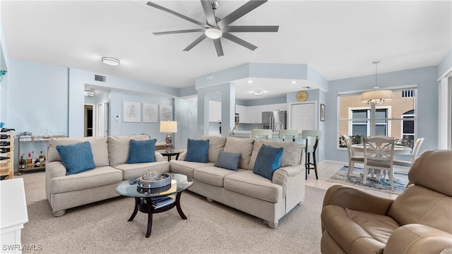 living room featuring ceiling fan and light tile patterned floors