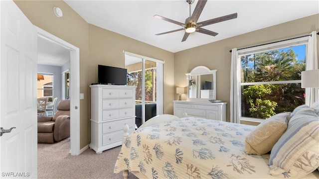 bedroom featuring ceiling fan and light colored carpet