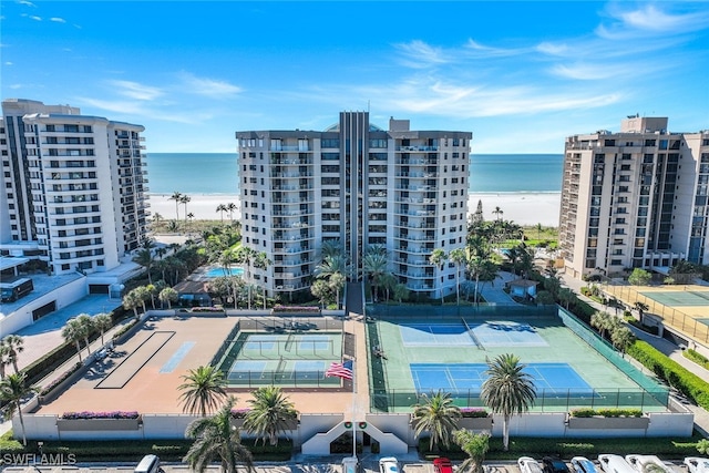 bird's eye view featuring a water view and a view of the beach