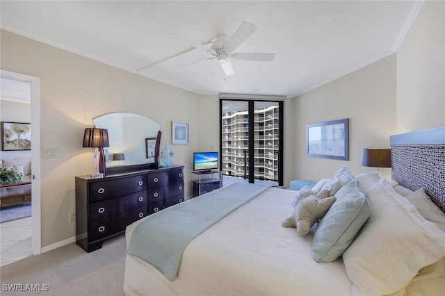 carpeted bedroom featuring access to exterior, ceiling fan, and crown molding