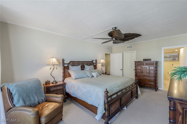 bedroom with a textured ceiling, light colored carpet, ceiling fan, and ornamental molding