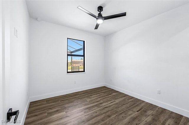 spare room featuring ceiling fan and dark hardwood / wood-style flooring