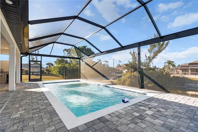 pool featuring a lanai and a patio