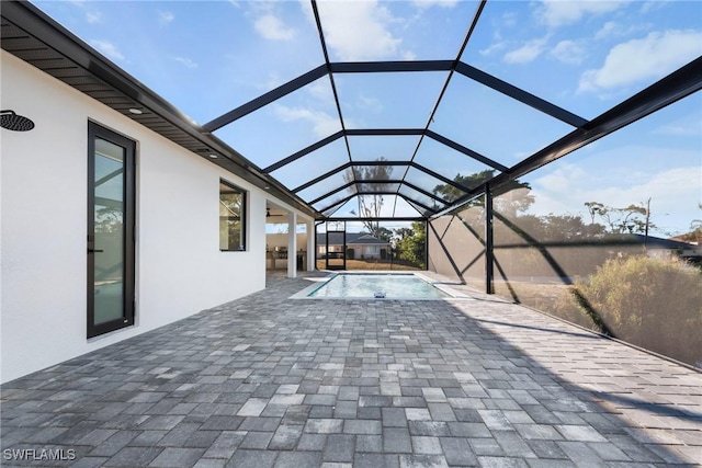 pool with a lanai and a patio area