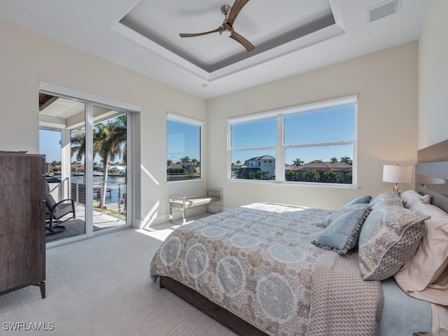 bedroom with carpet, access to outside, multiple windows, and ceiling fan