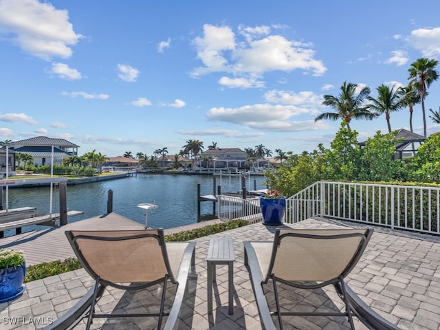 exterior space with a water view and a dock