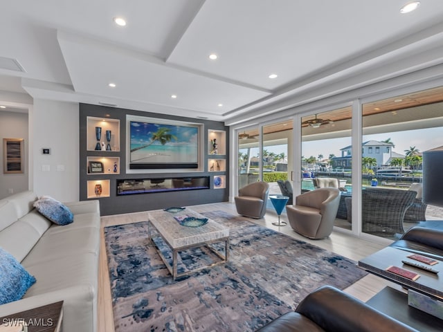 living room with hardwood / wood-style floors, french doors, and ceiling fan